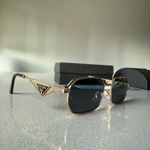 Prada Elegant Gold and Black Eyewear